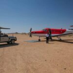 Are International Flights Between Kigali and Kilimanjaro/Seronera Included in Standard Luxury Packages?