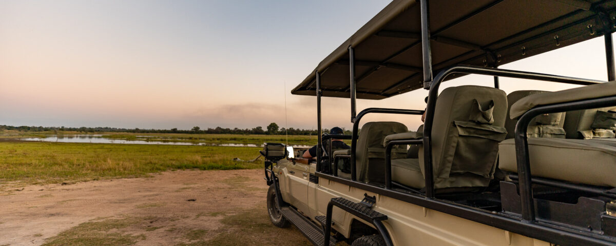 Are Airport Transfers Conducted in Open-Sided or Closed Luxury Safari Vehicles?