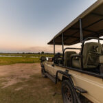Are Airport Transfers Conducted in Open-Sided or Closed Luxury Safari Vehicles?