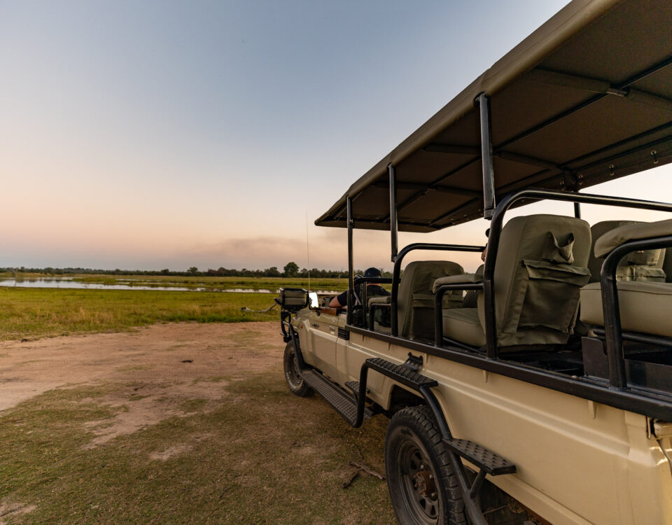 Are Airport Transfers Conducted in Open-Sided or Closed Luxury Safari Vehicles?