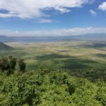 How Does the Terrain of Volcanoes National Park Compare to the Landscape of the Ngorongoro Crater?