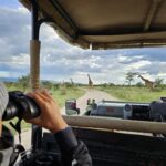 Are Airport Transfers Conducted in Open-Sided or Closed Luxury Safari Vehicles?