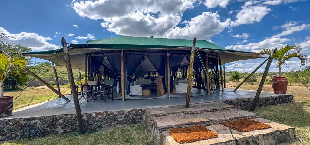 Can travelers choose to substitute one of the properties for a mobile tented camp to get closer to the migration?