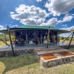 Can travelers choose to substitute one of the properties for a mobile tented camp to get closer to the migration?