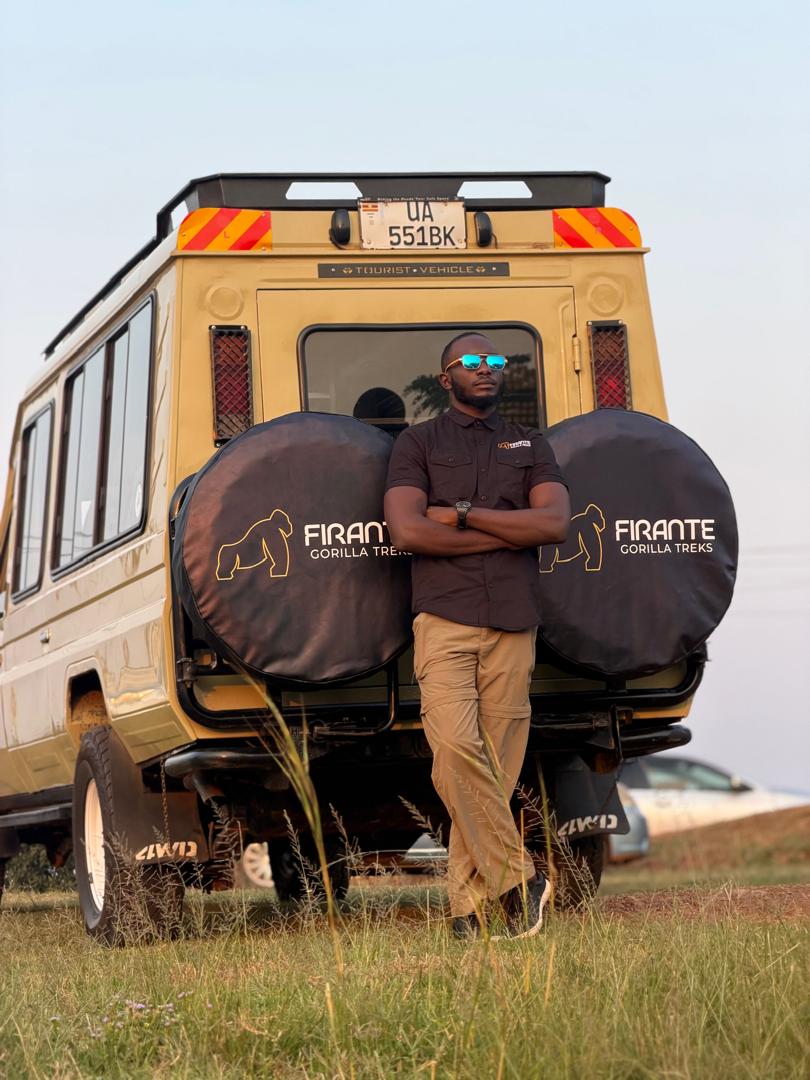 Home Mr Kawuma Ronald beside the Firante Gorilla Treks safari vehicle